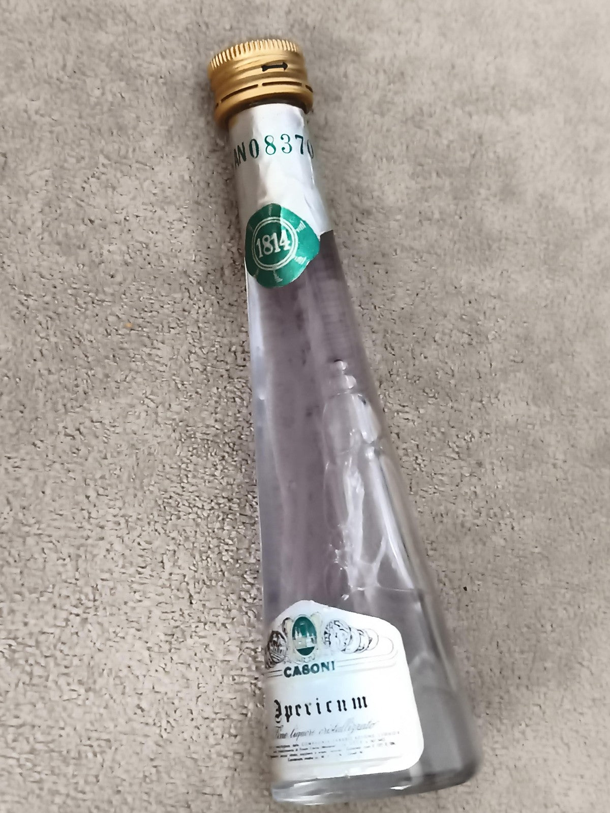 Miniature alcool CABONI Specicum 1814 bouteille conique partiellement remplie