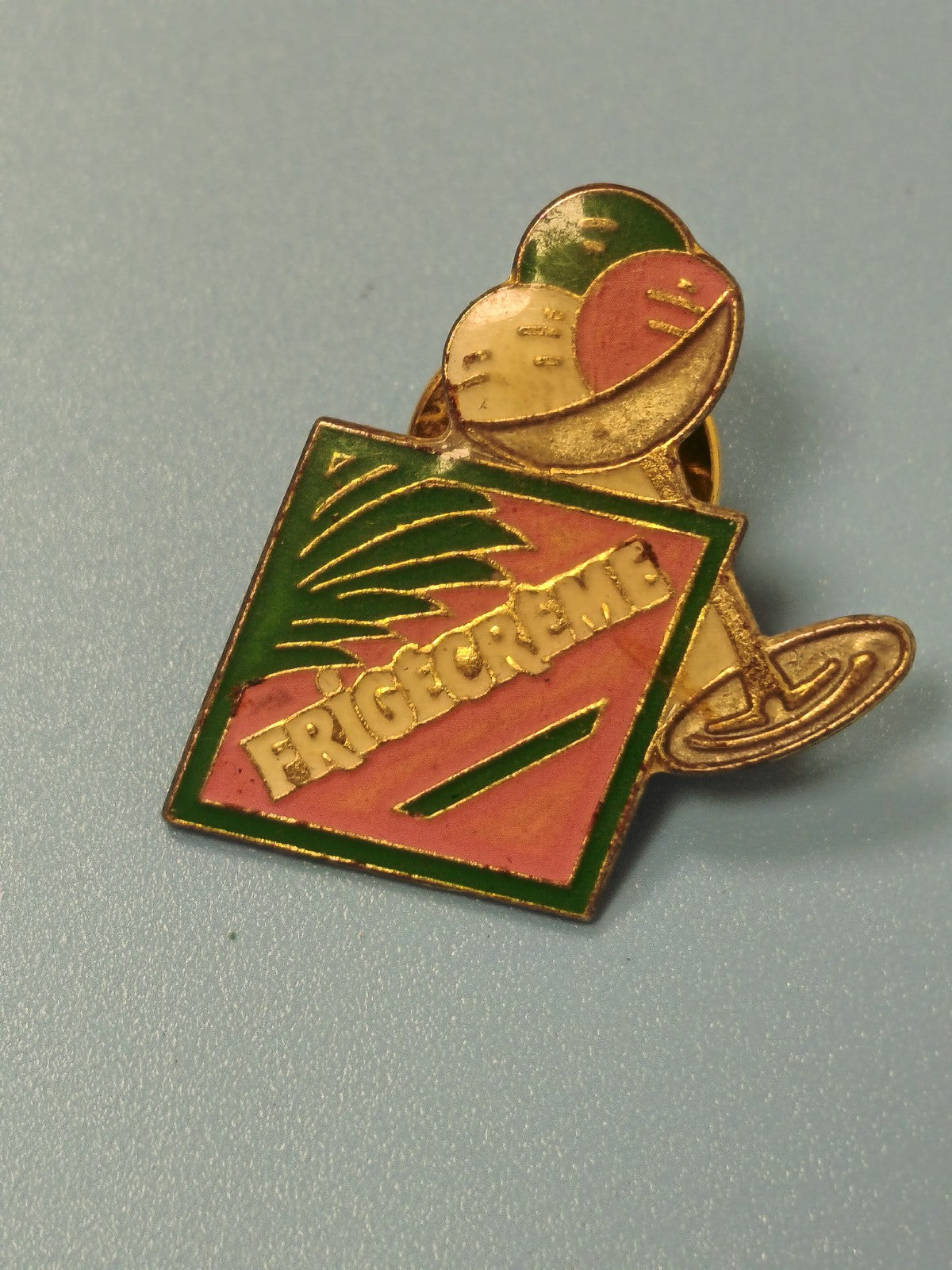 Vintage old Frigecreme advertising pin, green pink gold colors, collectio