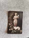 CPA Heureuses Pâques femme œufs fleurs REX 603 carte postale début XXe