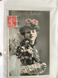 Carte postale ancienne Bonne Année, femme fleurs, CPA début XXe, timbre 10c