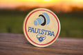 Pin's rond vintage PAULSTRA logo bleu doré, années 80, badge publicitaire