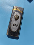 Ancien briquet publicitaire Jivet, décor visage, métal argenté, à restaurer