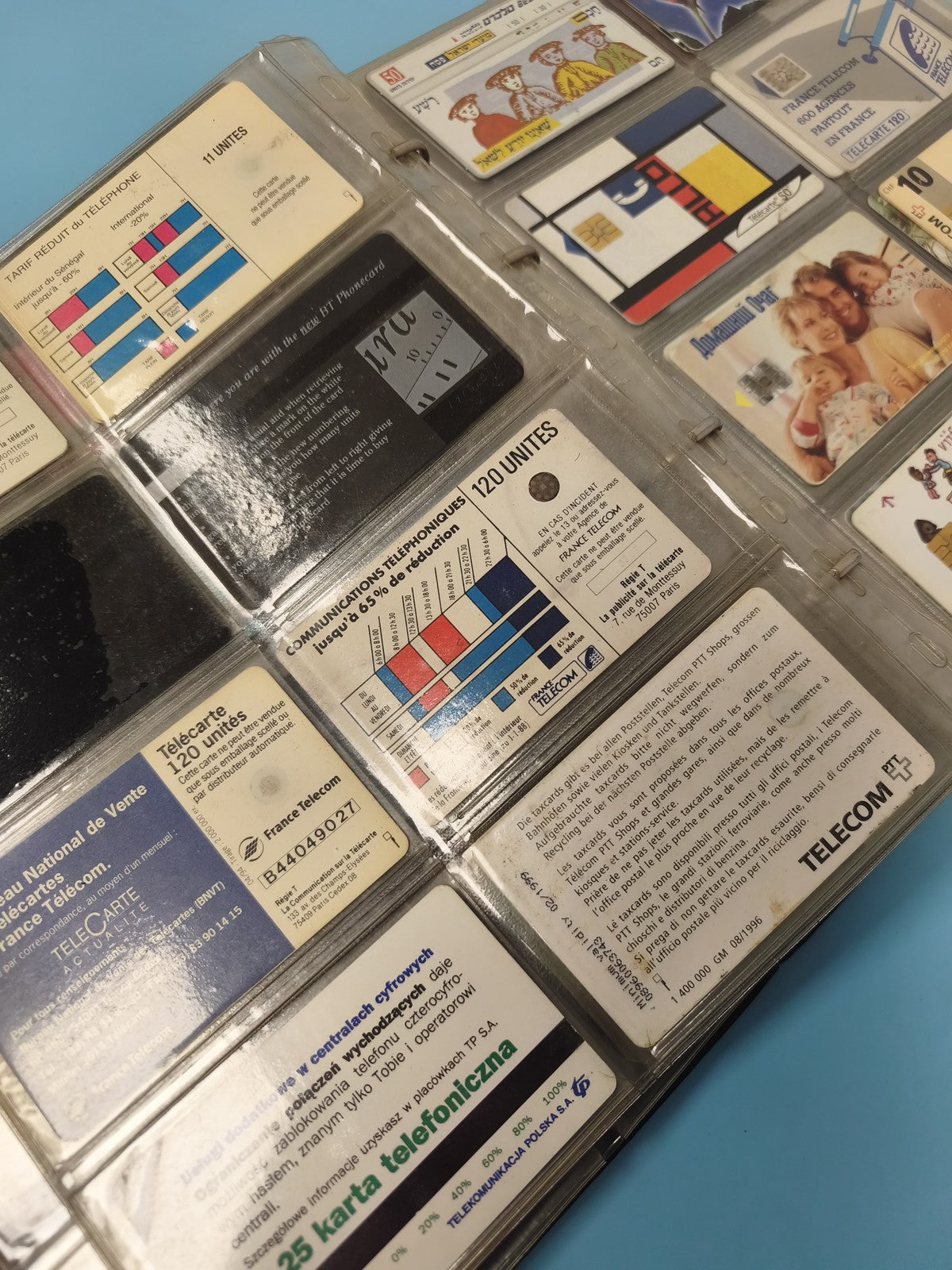 Vintage multi-coloured foreign phone card album collection