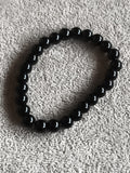 Bracelet perles noires pierres naturelles élastique élégant sobre