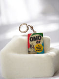 Porte-clés publicitaire OMO 67 vintage ancien rétro lessive années 60