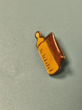 Vintage pin's Total biberon jaune, collection publicitaire rétro