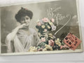 Carte postale ancienne Bonne Fête, portrait femme fleurs, timbre 1911 CPA
