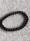 Bracelet perles rondes noir pierres naturelles élastique style mala