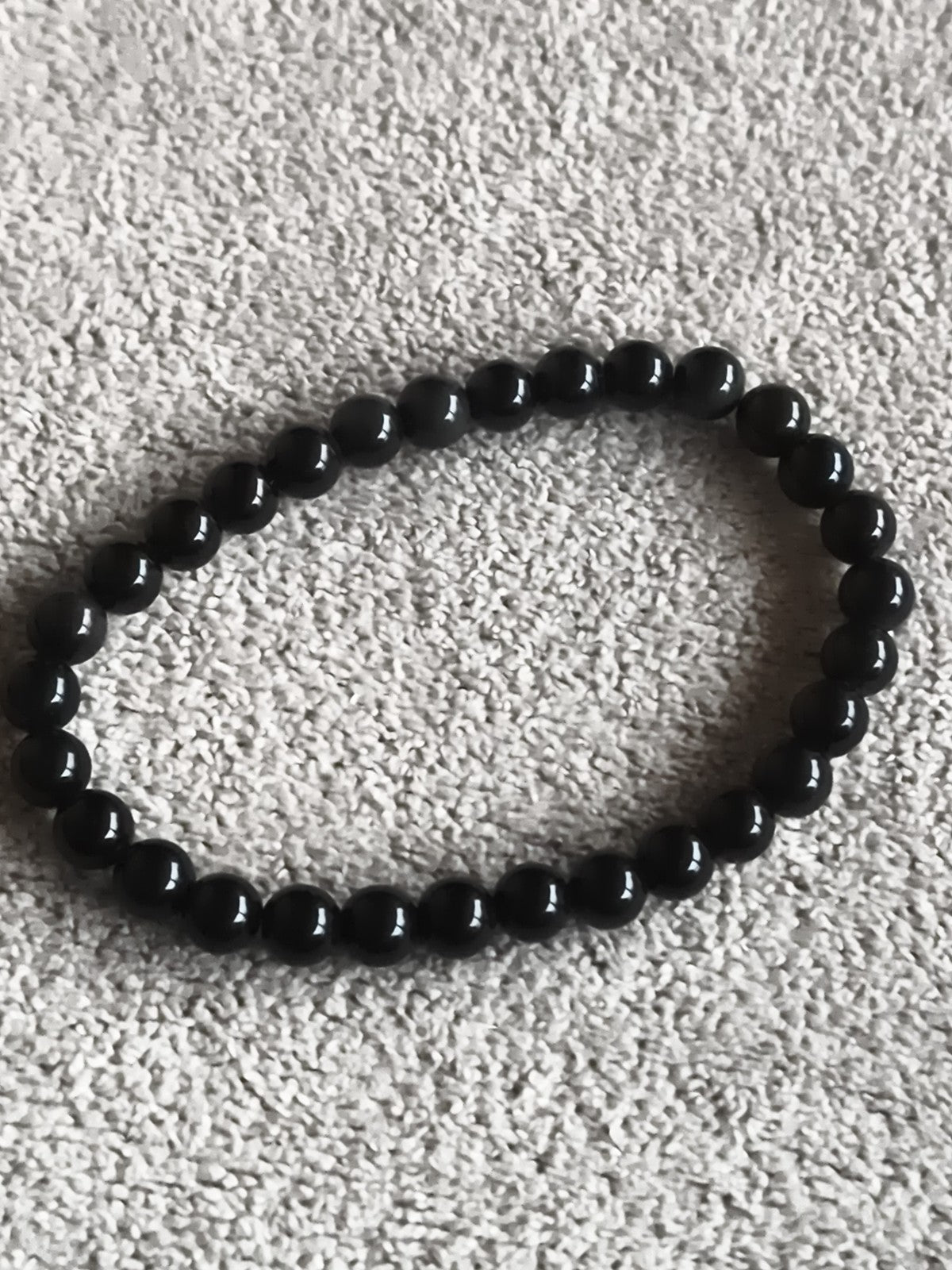 Bracelet perles rondes noir pierres naturelles élastique style mala