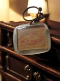 Porte-clés publicitaire vintage CH. Rieger Strasbourg translucide ancien