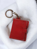 Porte-clés ancien vintage livre rouge rétro objet publicitaire rare