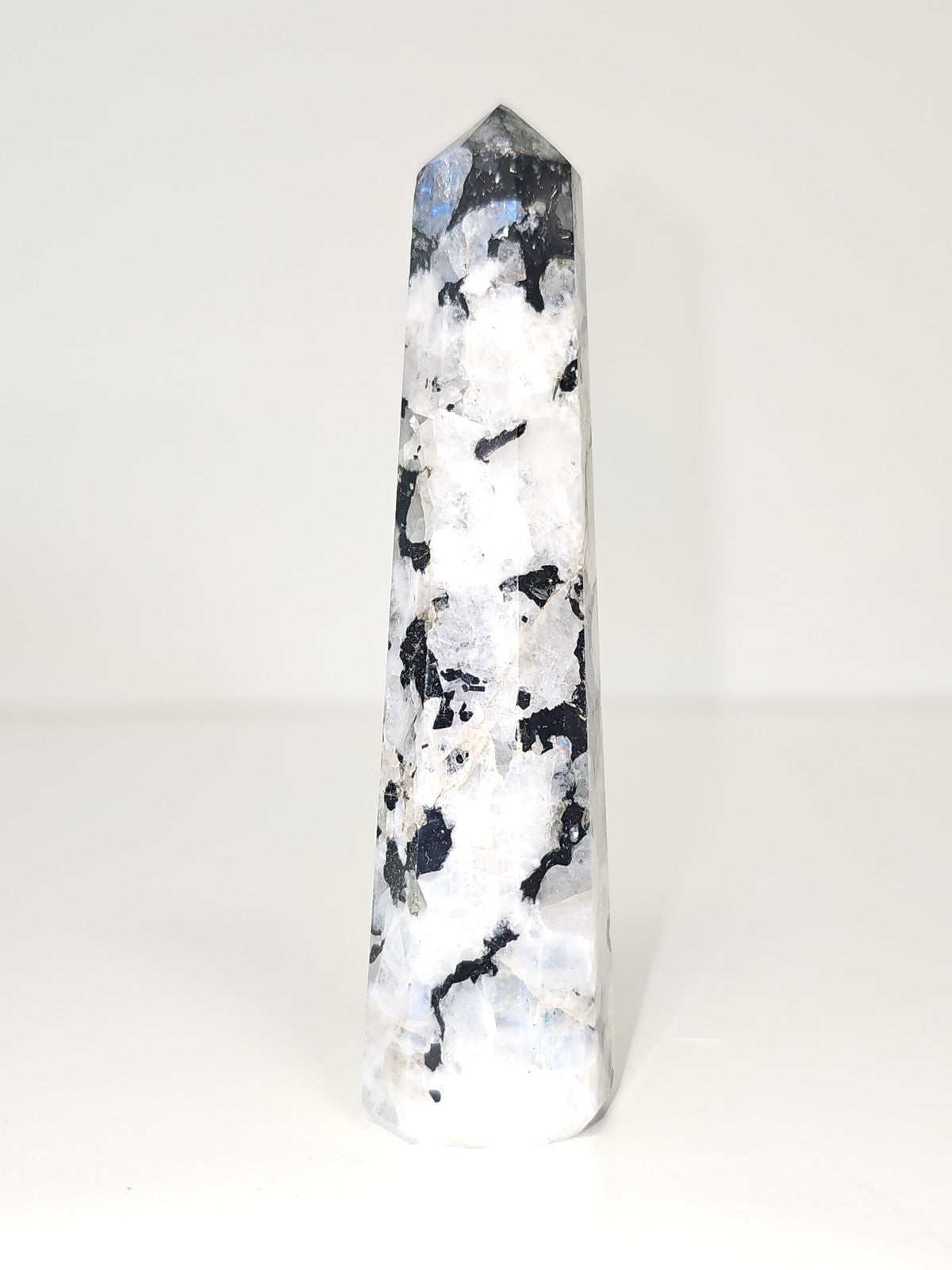 Vintage decorative obelisk in old natural stone, collectible figurine