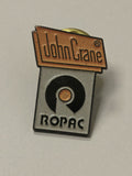 Pin's rétro ancien John Crane badge vintage collection objet publicitaire rare