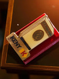 Pin's publicitaire vintage émail Keny K, forme paquet, années 80-90