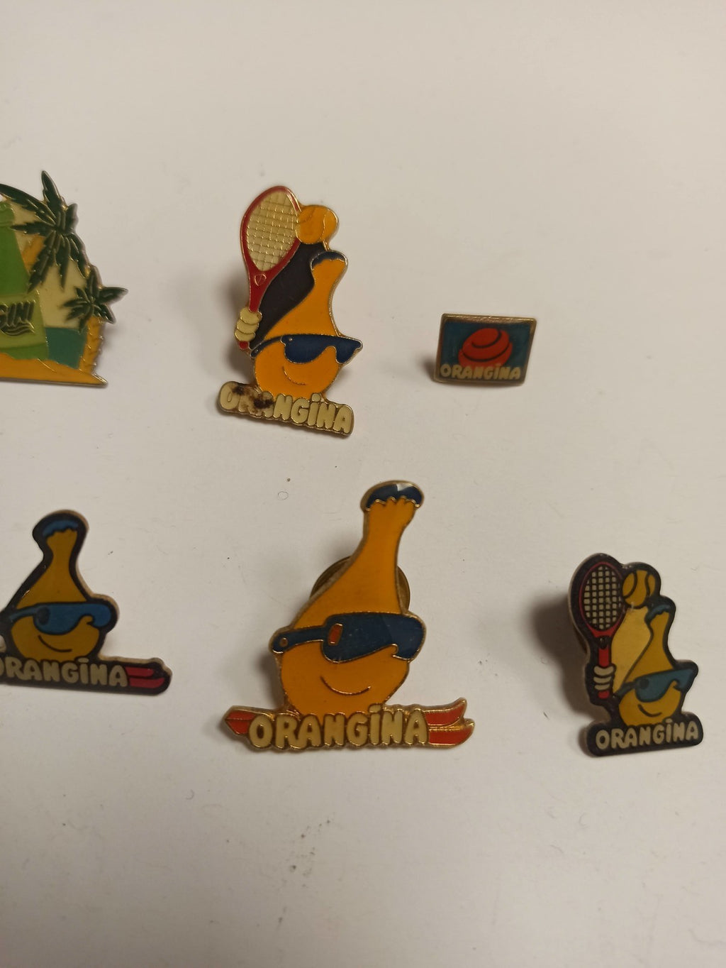 Lot 10 pin's Orangina vintage rétro années 80, publicitaires, mascottes