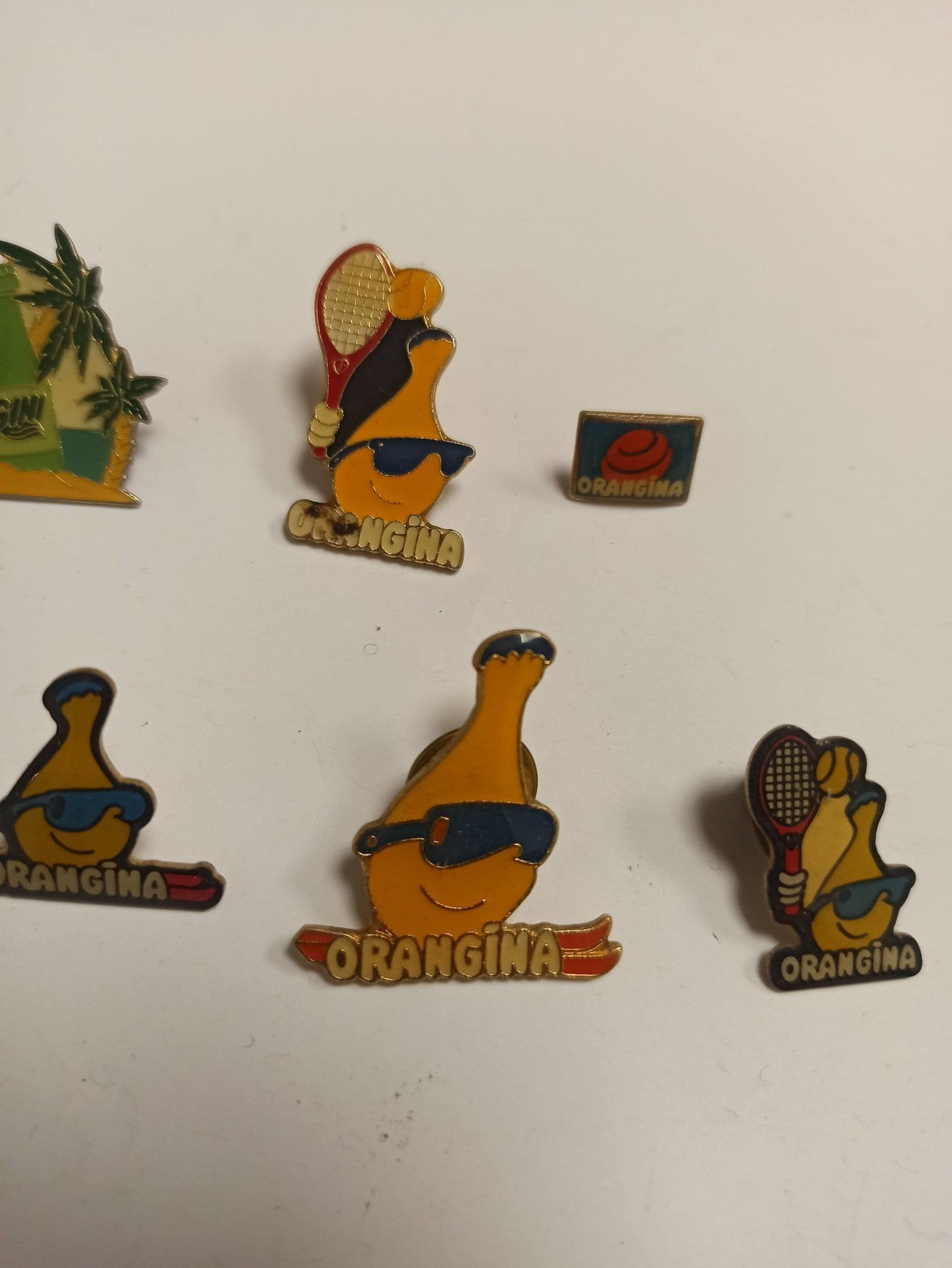 Lot 10 pin's Orangina vintage rétro années 80, publicitaires, mascottes