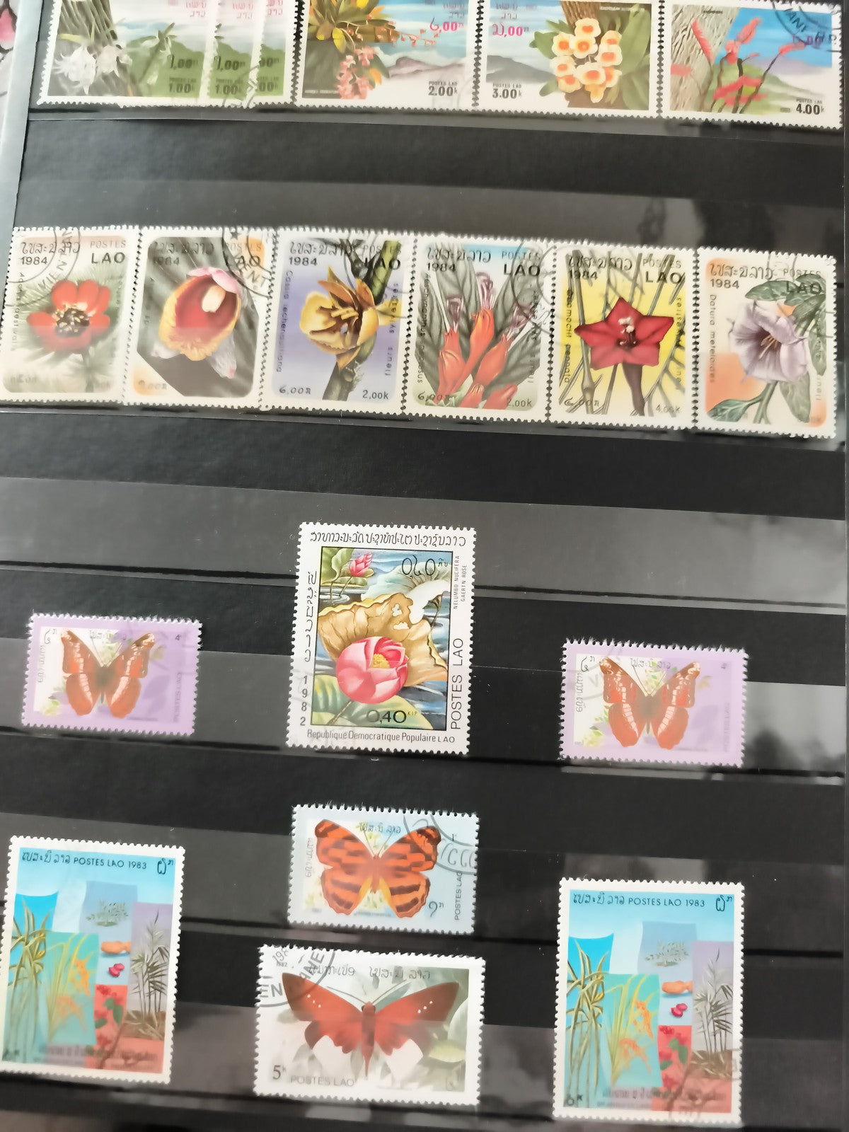 Timbres anciens Laos 1983-1984 fleurs papillons oblitérés philatélie vintage