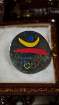 Pin's rond Jeux Olympiques Barcelone 1992 logo officiel couleurs