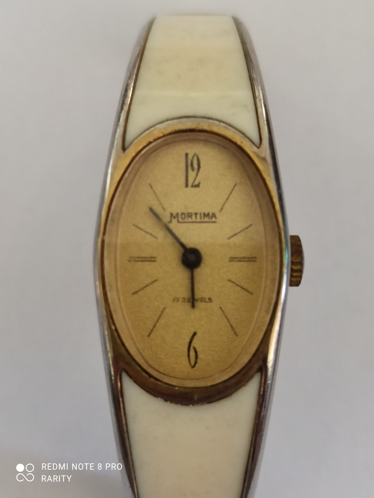 Montre vintage femme Mortima ovale cadran doré bracelet blanc rétro