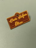 Pin's vintage Etam "Envie d'ailleurs" émaillé rectangulaire marron (Ref 18)