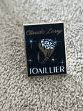 Pin's vintage Claude Levy Joaillier bijouterie noir doré (Ref 8)