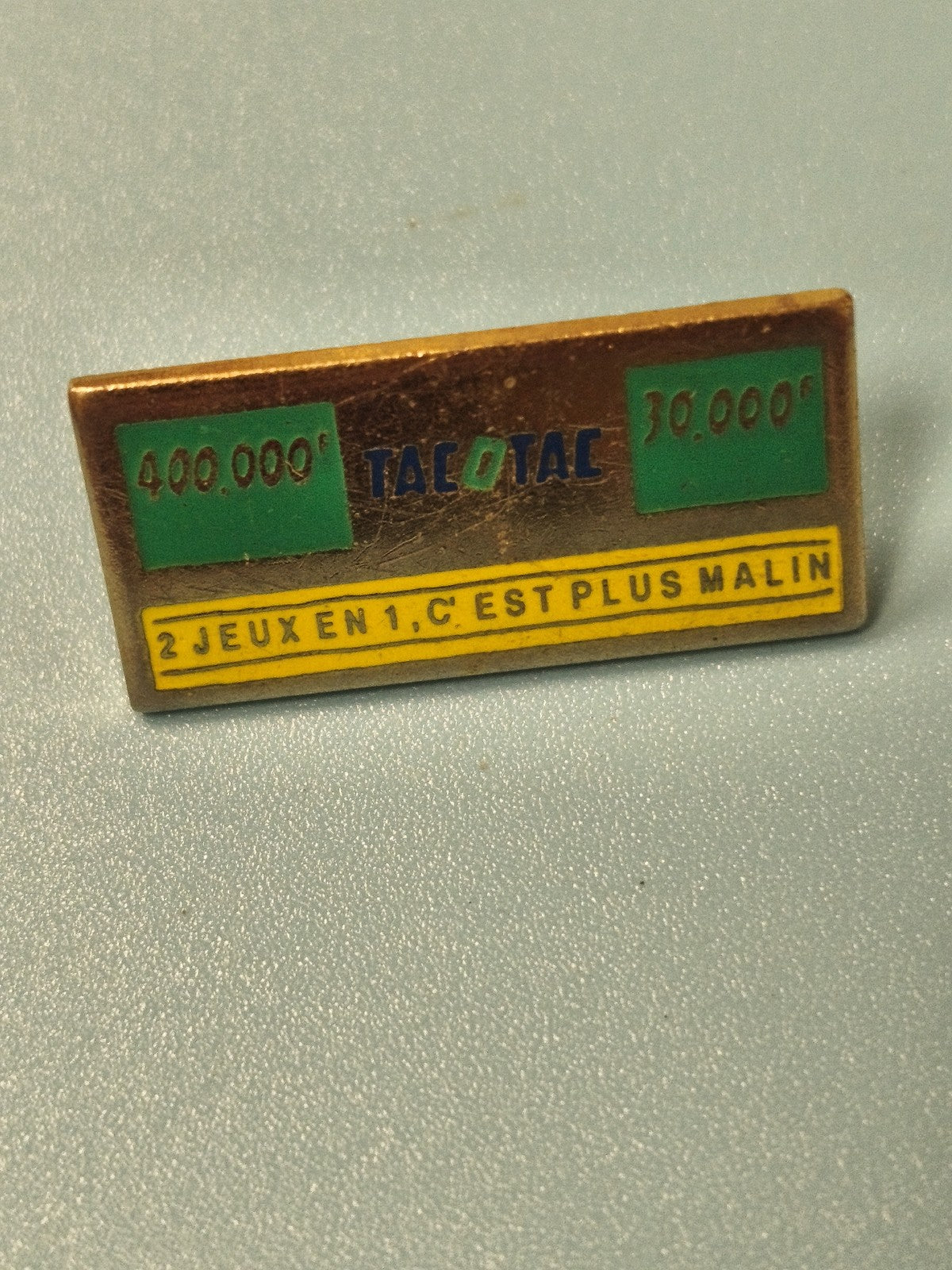 Pin's vintage publicitaire Tacotac rectangulaire, années 80, jeux de loterie