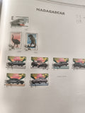Timbres Madagascar oblitérés autos trains dinosaures oiseaux philatélie