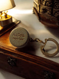 Porte-clés vintage Astra Supertine publicitaire rond aspect métal ancien