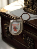 Porte-clés vintage publicitaire Scotch Saint-Étienne 42 translucide ancien