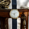 Montre vintage LEX Incabloc automatique cadran blanc, bracelet tressé bleu