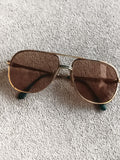 Lunettes vintage Lacoste monture dorée style aviateur verres teintés ancien