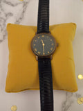 Montre femme vintage Caravelle cadran noir doré rétro bracelet effet croco