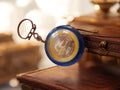 Porte-clés publicitaire vintage Bridel bleu rond fromage rétro
