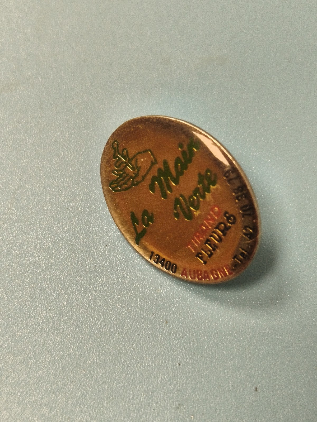Vintage pin's ovale La Main Verte vert doré, fleuriste Aubagne collection (Ref 7