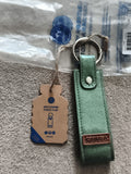 Porte-clés Cabaia vert aspect cuir avec étiquette logo, neuf, keychain