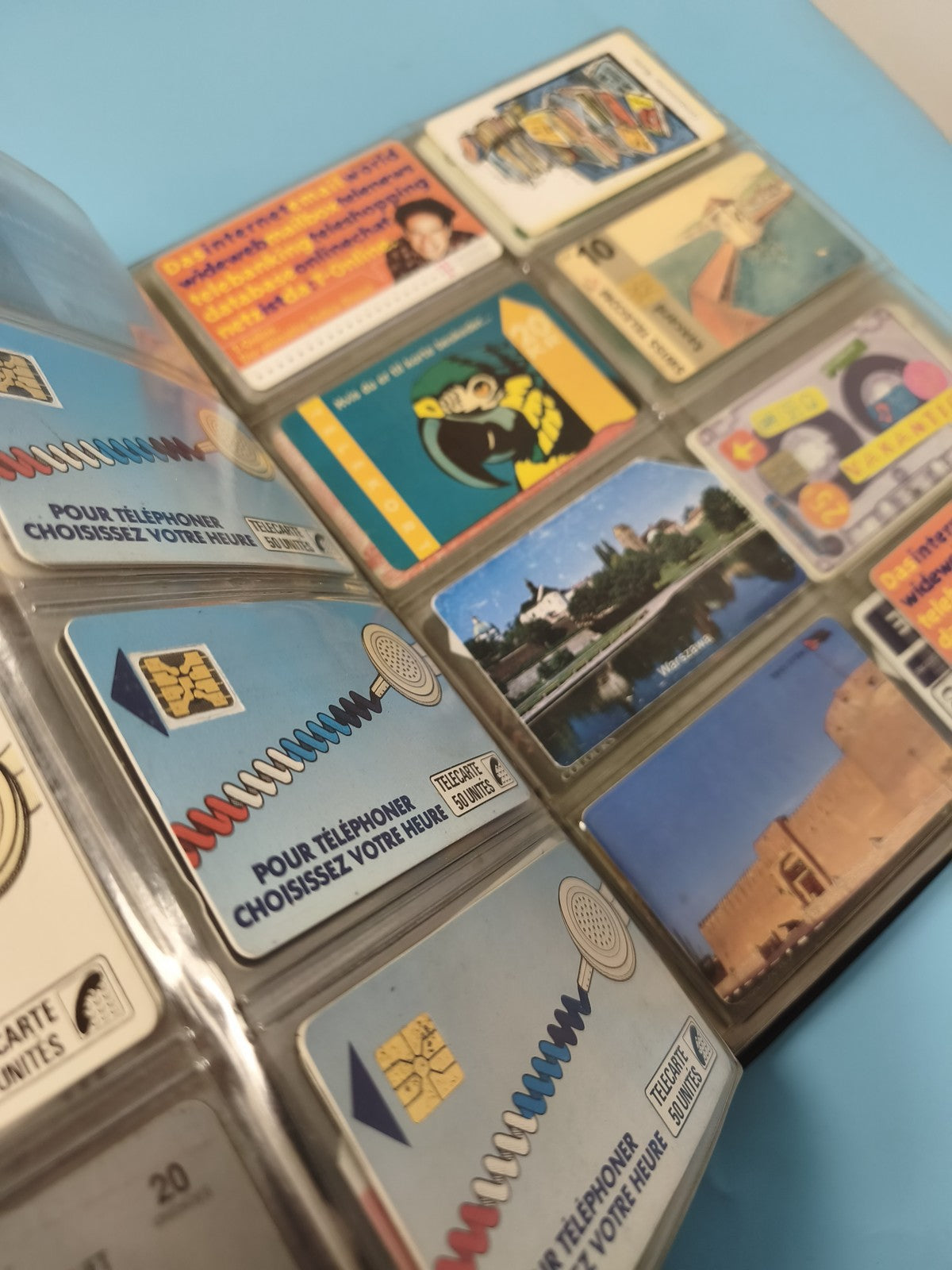 Vintage multi-coloured foreign phone card album collection
