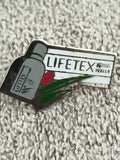 Pin's publicitaire vintage LIFETEX Wella, logo bouteille, années 90 (Ref 1)