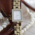 Montre carrée L Paris vintage quartz dorée France bracelet métal années 80