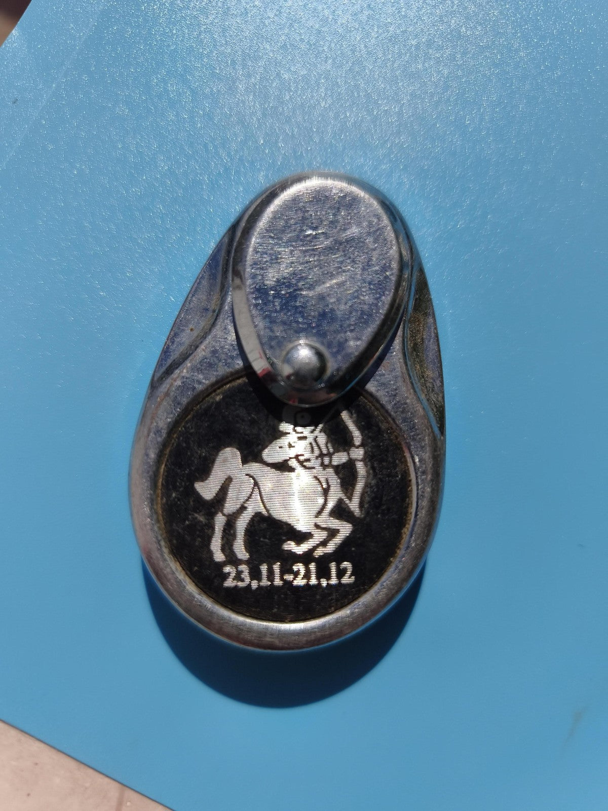 Ancien briquet publicitaire zodiaque Sagittaire métal chromé à motif gravé