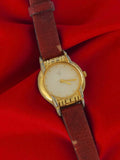 Montre femme vintage Geoffrey Beene dorée, ancien bracelet cuir brun