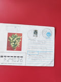 Enveloppe philatélie timbrée avec illustration florale, cachets visibles