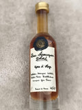 Miniature Bas-Armagnac Delord Hors d’Âge, bouteille partiellement remplie