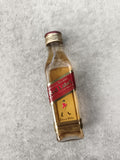 Miniature whisky Johnnie Walker Red Label bouteille partiellement remplie
