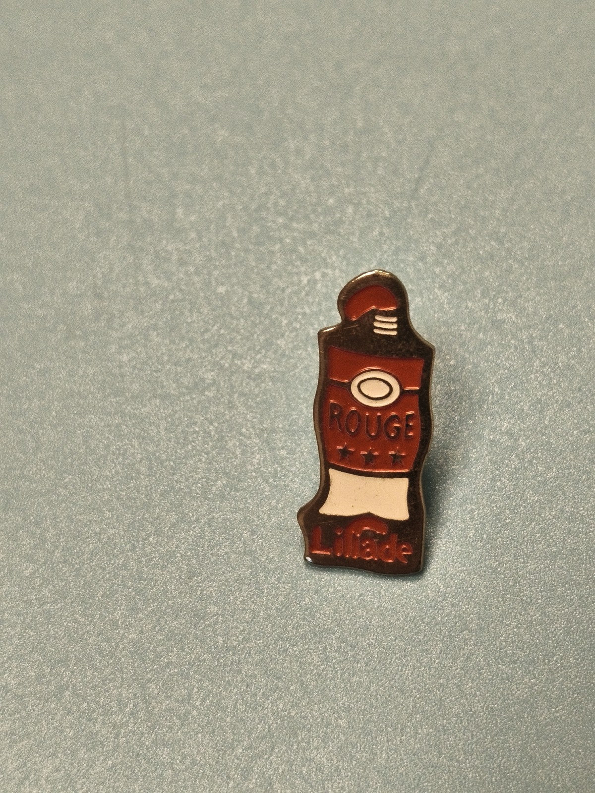 Vintage pin's publicitaire Lillade tube rouge émaillé collection années 90