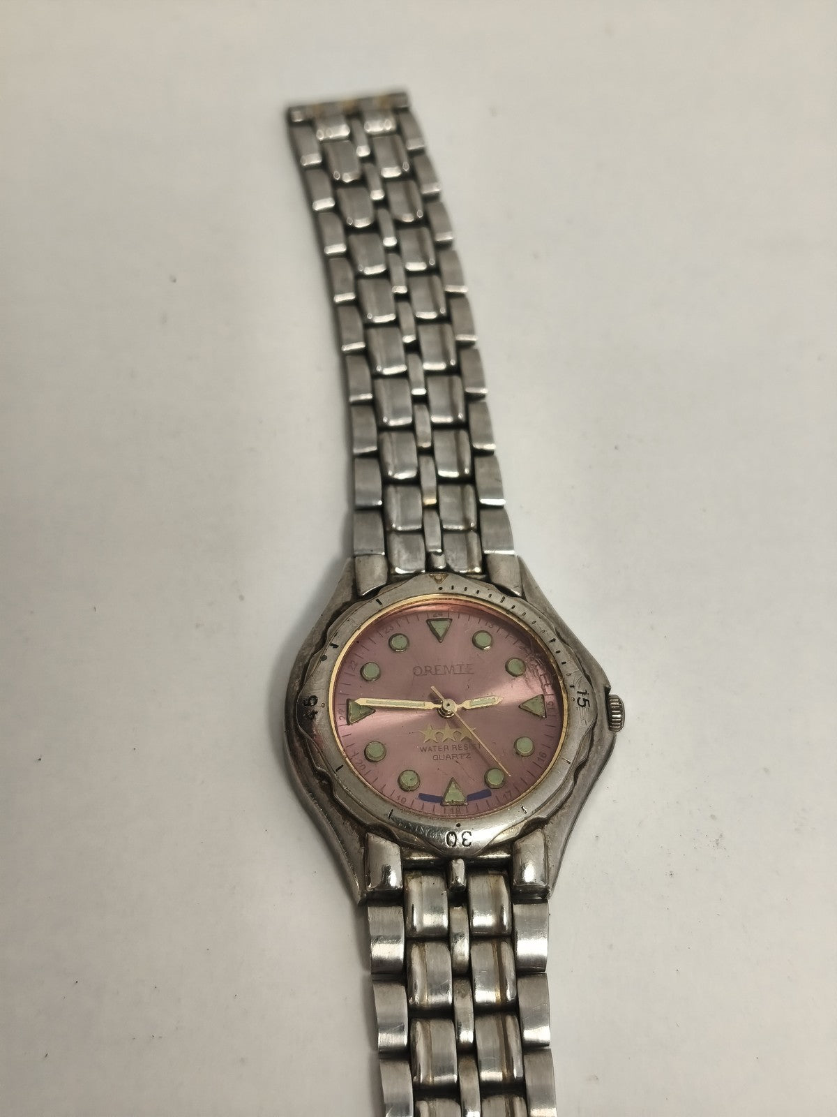 Montre vintage Oremie quartz cadran rose acier aspect sport non testée