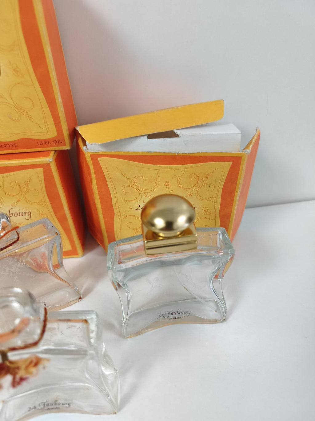 Gros lot flacons vides Hermès 24 Faubourg avec boîtes orange et doré