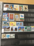 Lot de timbres poste du Népal multicolores thèmes variés (support non inclus)