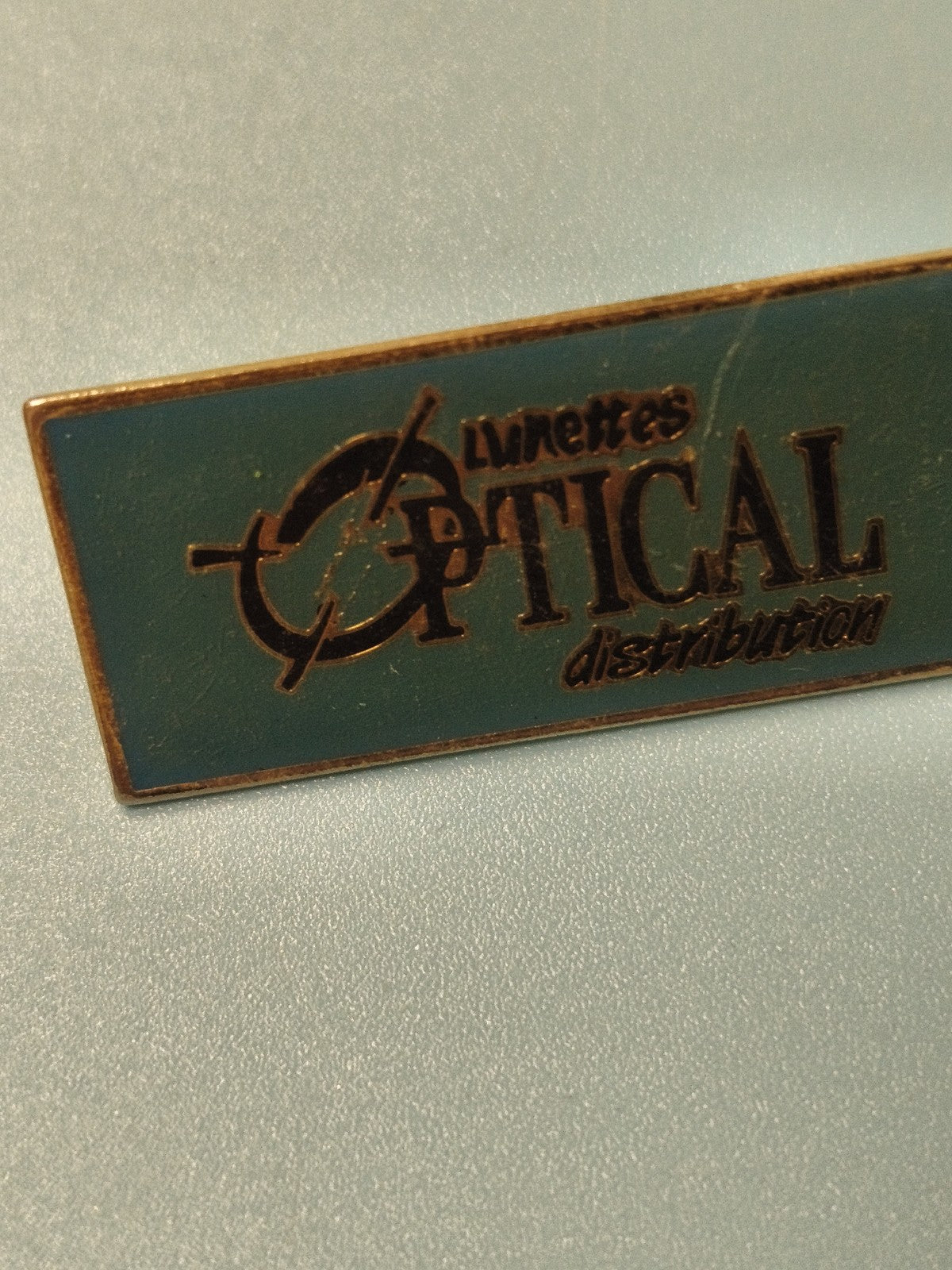 Vintage pin's Lunettes Optical distribution, rectangulaire, bleu vert, collectio