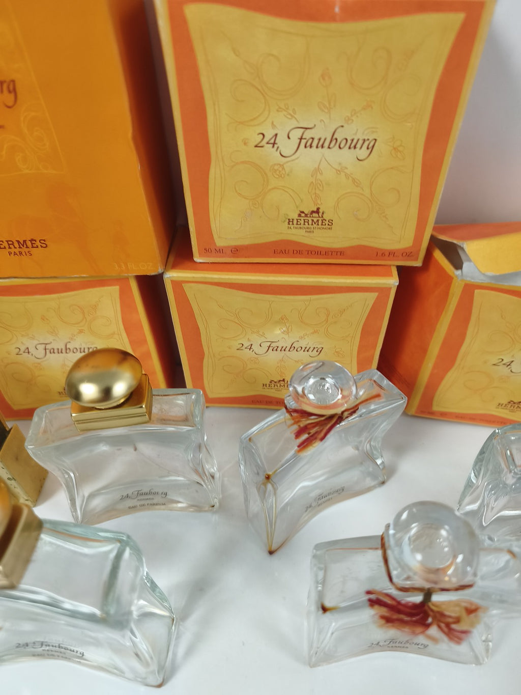 Gros lot flacons vides Hermès 24 Faubourg avec boîtes orange et doré