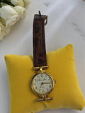 Montre femme vintage Charles Léman, cadran doré, bracelet marron, quartz